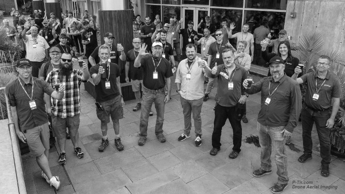 Building Science Symposium attendees toasting from a balcony at Boulevard Brewery in Kansas City, Missouri