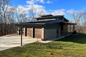 Catalyst House in the woods. Front view 45" to the right